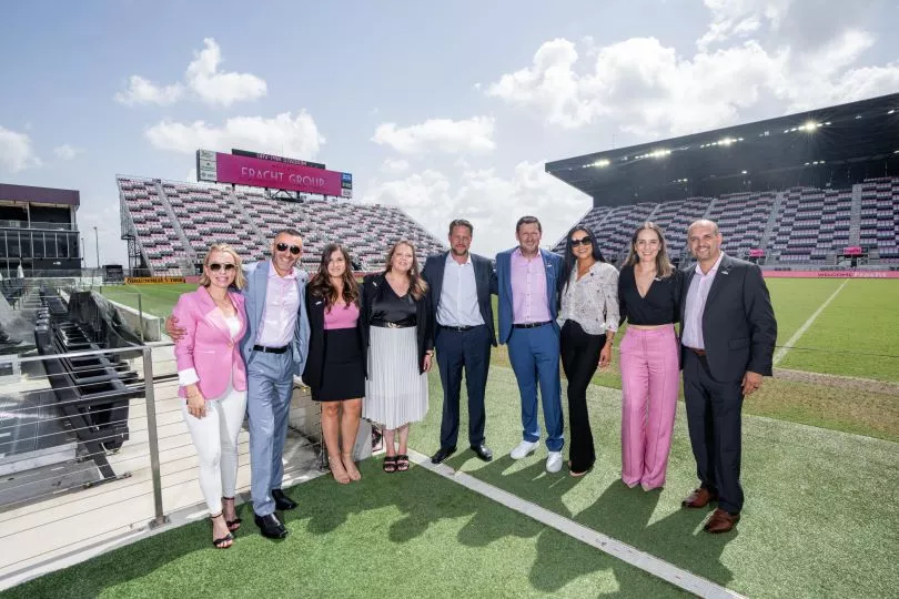 Group of South Wind employees on a soccer pitch