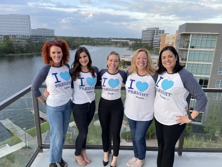 Five South Wind employees on a balcony
